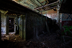 abandoned factory basement with fragments and bricks walls