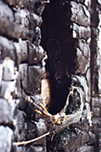 ashes on burnt wall and window frame