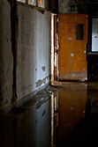 abandoned school corridor with opened doors and light