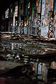 water reflection in puddles in dilapidated building interior