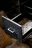 open drawer on old and rusty desk