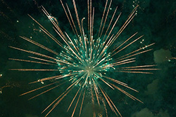 green fireworks sparkle and puffs of smoke