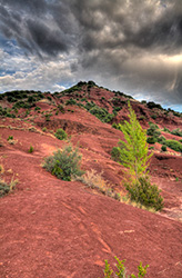 Salagou lake hill HDR with red soil and rocks
