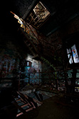 rusty stairs and graffiti in disused factory with light painting