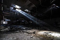 sunlight from ceiling in abandoned building