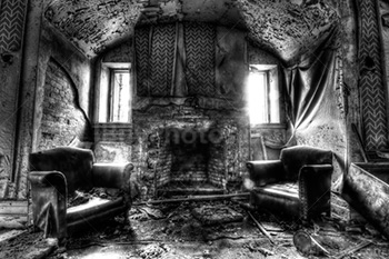 Haunted house with fireplace and armchairs, light from windows, black and white photo