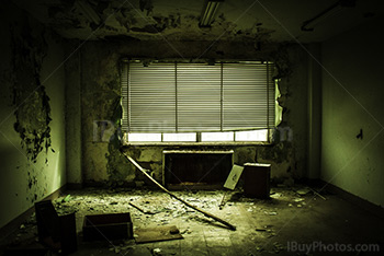 Creepy office with destroyed furniture and venitian blinds