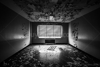 Abandoned office with venitian blinds, room perspective in black and white picture