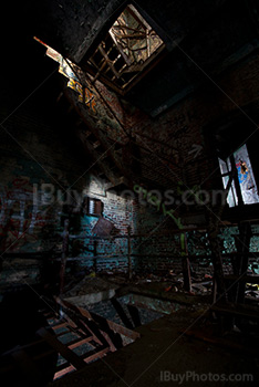 Rusty stairs and graffiti in disused factory with light painting