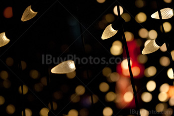 Fairy lights and strings with glimmer lights on background