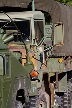 Military truck with camouflage tarp