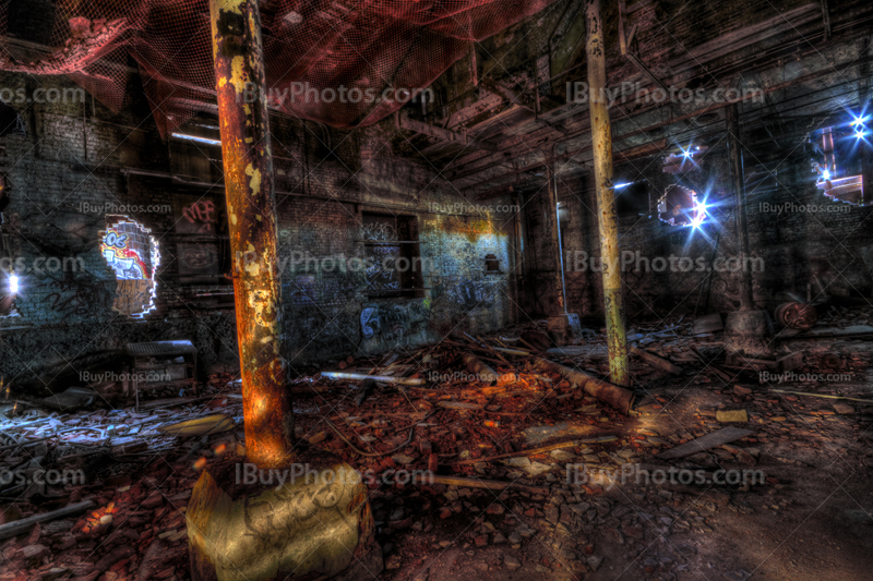 Abandoned factory interior art with pillars and fragments