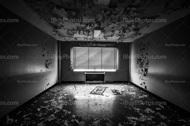 Abandoned office with venitian blinds, room perspective in black and white picture