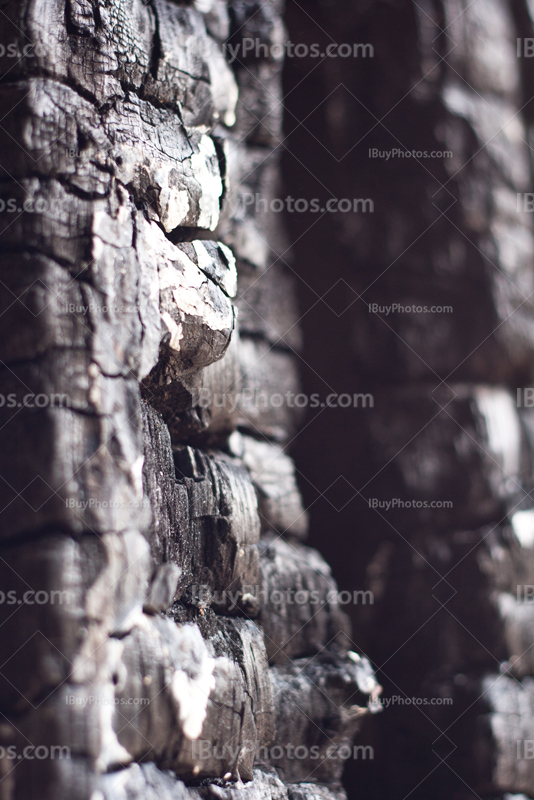 Burnt wall with ashes in abandoned house