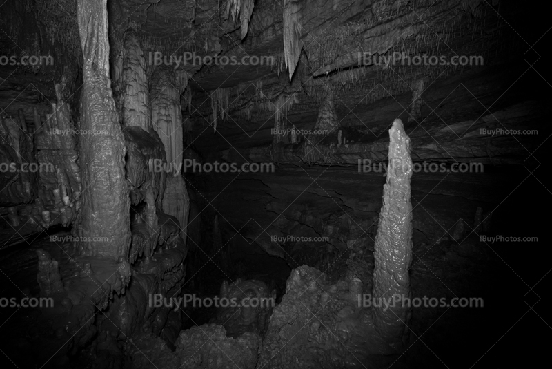 Cave with stalactites and stalagmites in black and white picture