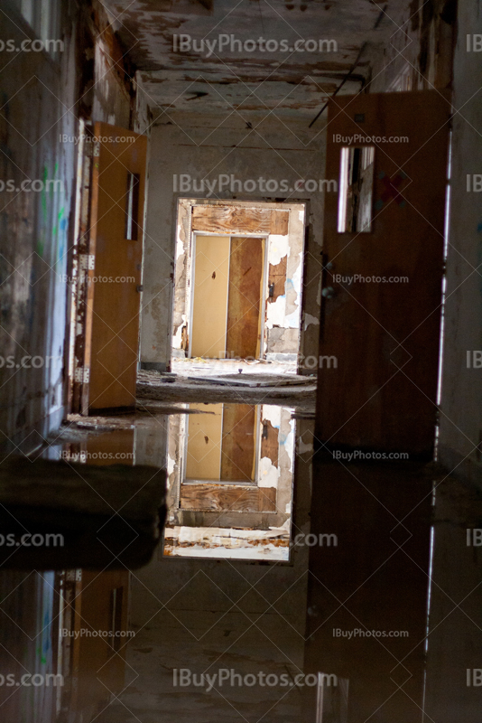 Inundated school hallway with opened door