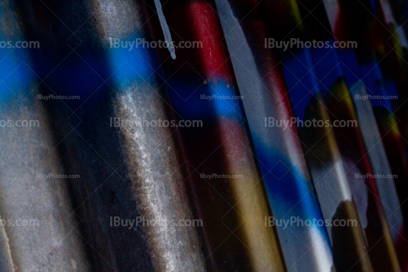 Corrugated iron with graffiti and shades