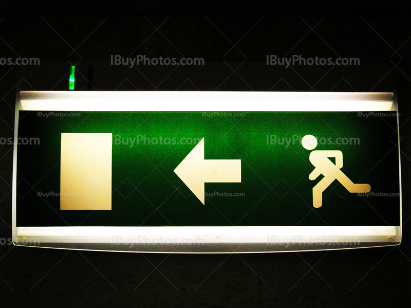 Green exit sign with door, arrow and man