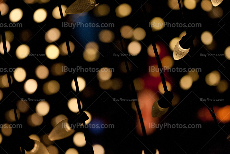 White fairy lights with blue and red glimmer lights on background