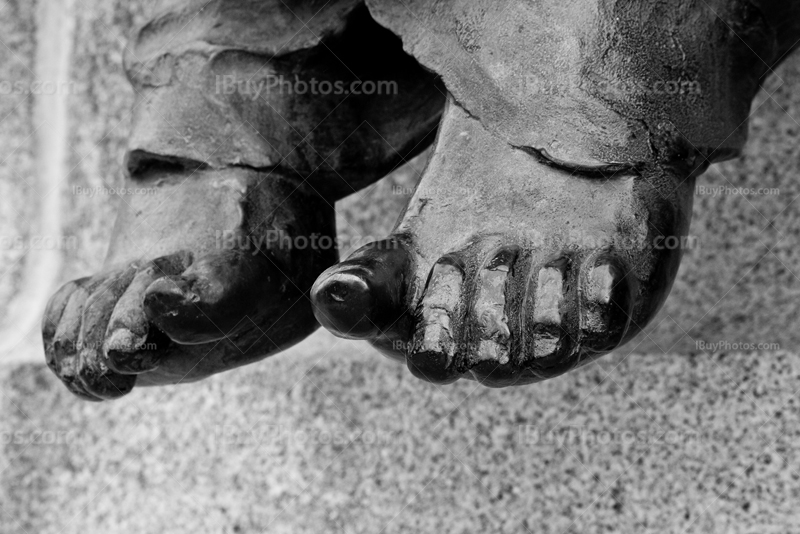 Statue feet in black and white picture