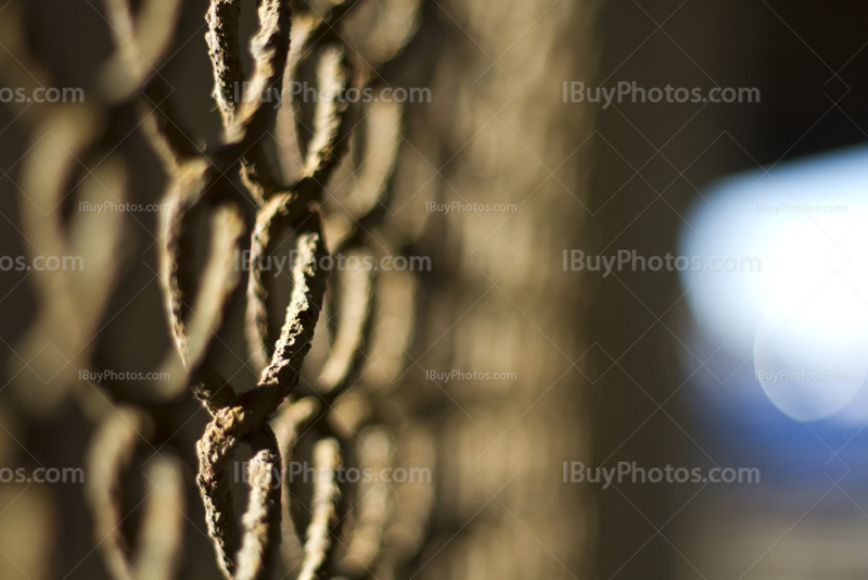 Rusty chain link fence perspective, close-up