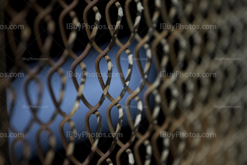 Rusty fence perspective, chain link close-up