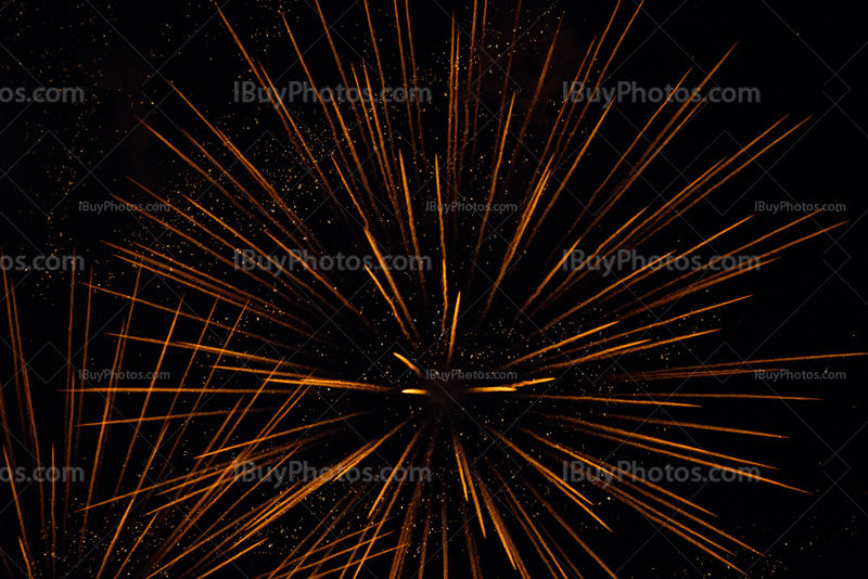 Orange firework explosion with sparkles