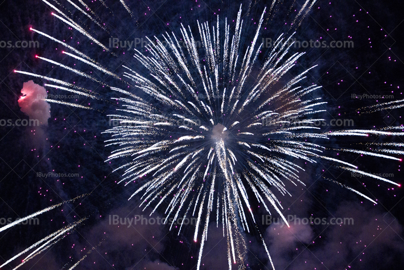 Fireworks explosion with puffs smoke