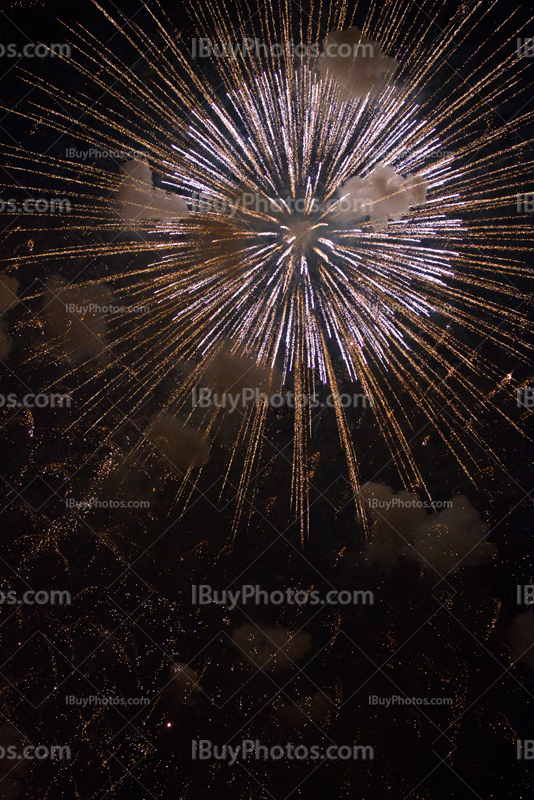 Fireworks explosion with puffs of smoke