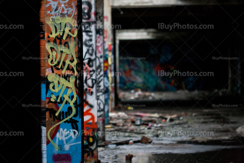 Graffiti on pillars in industrial building