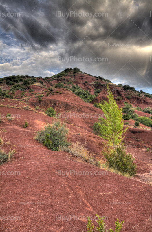 Salagou lake hill HDR with red soil and rocks