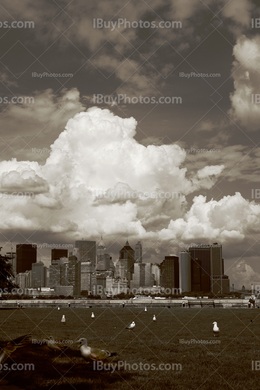 Manhattan skyline under clouds in colored photo, New York City