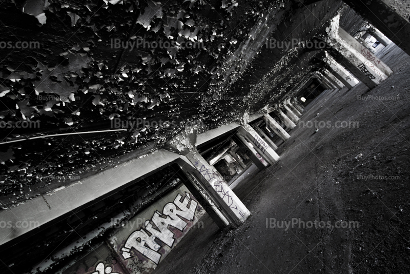 Abandoned car park with peeling paint texture on ceiling