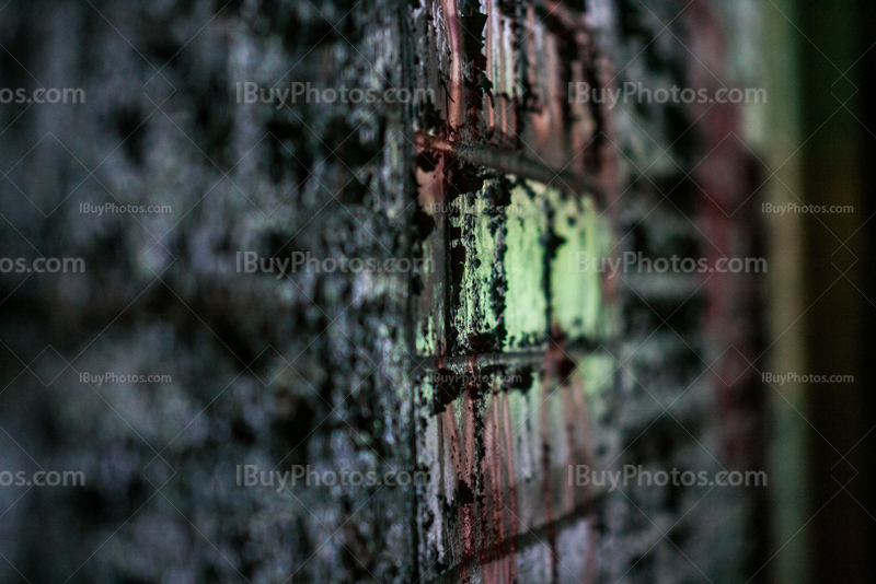 Wall with bricks and old crackling paint