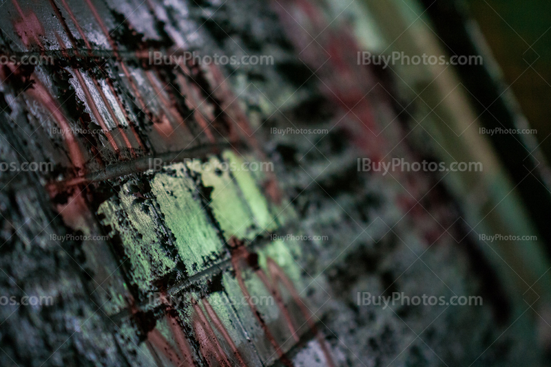 Inclined bricks wall with peeling paint