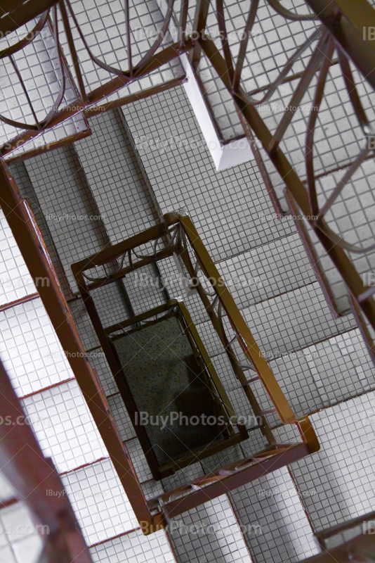 Spiral staircase with banister in building