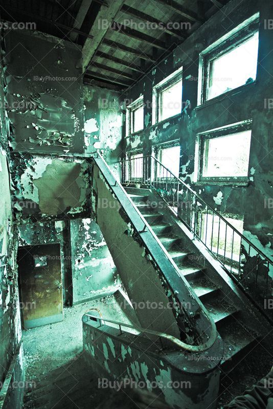 Damaged steps on old stairs in abandoned building