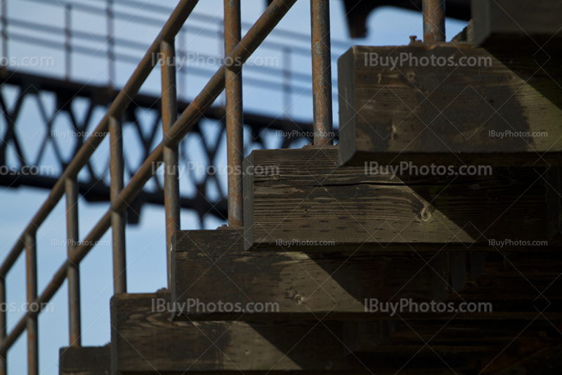 Bridge structure with wooden beams and metal banister