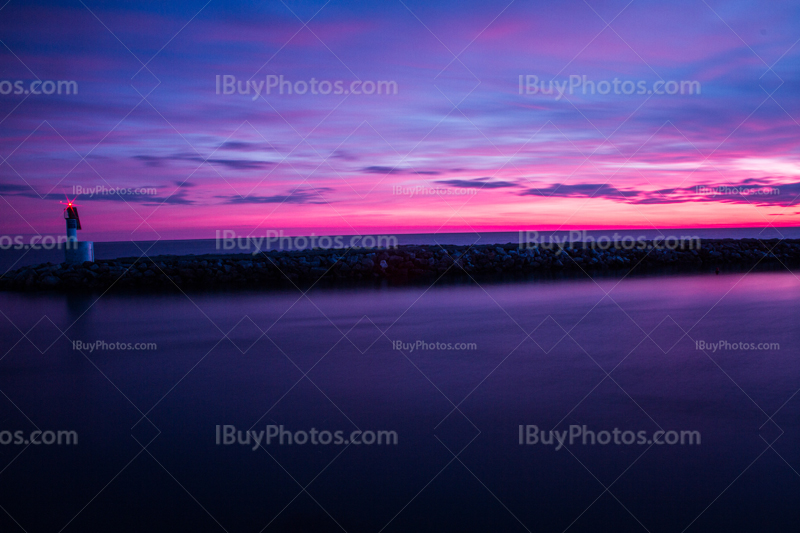 Lighthouse at sunset near Mediterranean sea