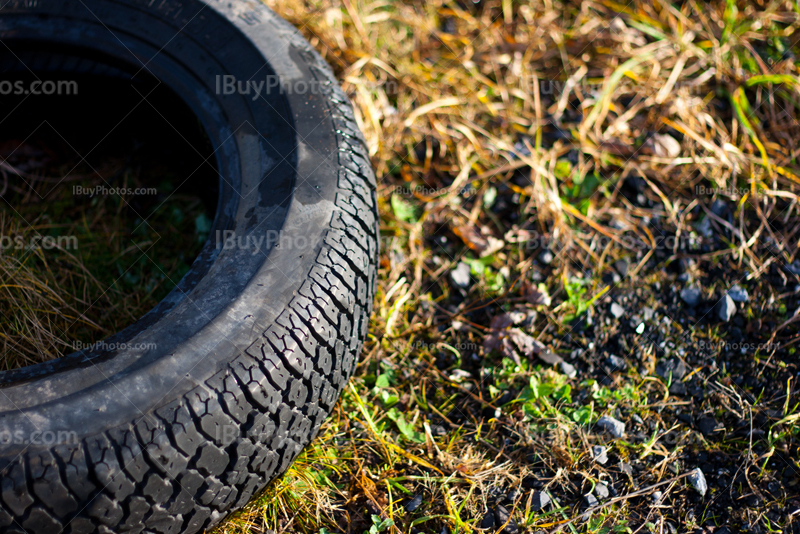 Tire close-up on grass with sunlight