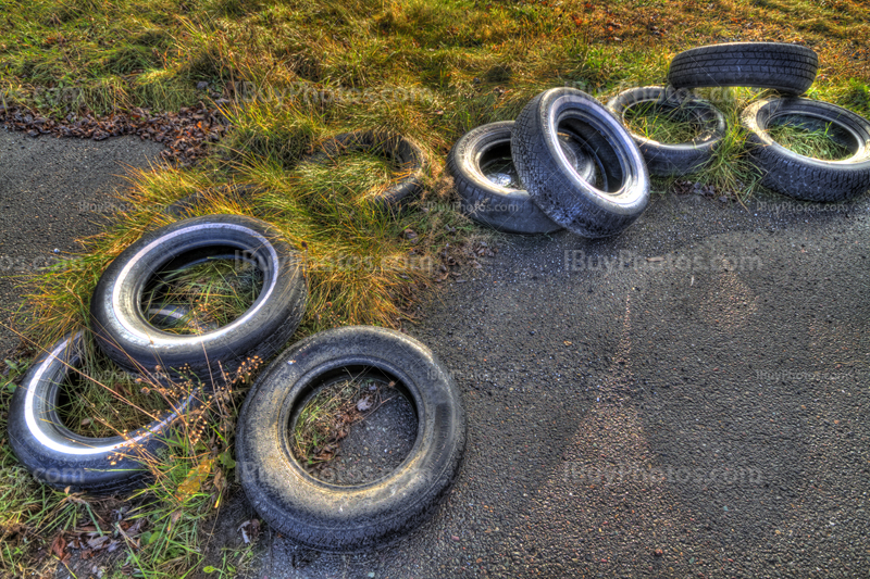 Used tires HDR on ground, asphalt and grass