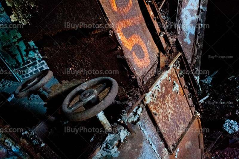 Rusty wheel valve in abandoned factory