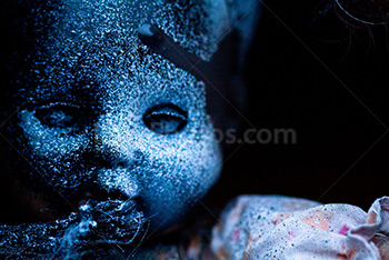 Creepy doll portrait with spray paint splatters