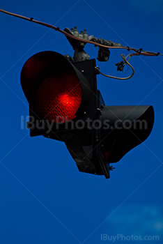 Red road light on cable with blue sky