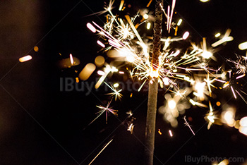 Sparkler burning with sparkles and light