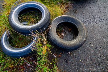 Tires on asphalt and grass