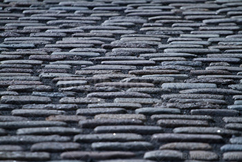 Cobblestones sidewalk in street