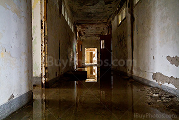 Abandoned corridor with water on floor