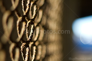 Rusty chain link fence perspective, close-up