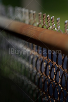 Rusty chain link fence top with vanishing point